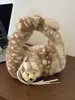 Bolso de mano de felpa de alta gama para mujer, nuevo y moderno 2026, versátil, con textura peluda, bolsa tote para el día a día