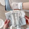 Calcetines finos de mujer serie azul y blanco para primavera y verano con lazos de cinta blanca, bordado de oso y diseño de malla calada