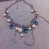 Collar con borla de perla y estrella de cinco puntas con incrustaciones de diamantes azules, dulce y fresco, con diseño de nicho único.