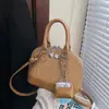 Bolsa de Concha Retro de Nicho Transfronteiriça para Mulheres Nova Cor Combinada Versátil Bolsa de Mão de Alta Qualidade para Comutação Ombro Cruzada