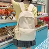 Mochila Meninas Estudantes Universitários Fresca Simples Versátil Leve Grande Capacidade Alta Aparência Nicho Estudantes do Ensino Fundamental Bolsa de Ombro Dupla