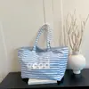 Bolso tote nuevo de moda transfronterizo estilo casual coreano, bolso de mujer de gran capacidad, bolso de lona a rayas estilo universitario