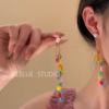 Xinyi oculto ~ aretes de borla con cuentas de mariposa de dopamina para mujer, aretes de alta gama, aretes con ambiente de primavera y verano