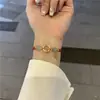 Pulseira Ping An Buckle Fu Brand Donut Corda Vermelha Tecida Doce Casal Corda de Mão Namorada Estudante Namorada Presente Joia