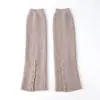 Polainas de punto para otoño e invierno con detalles de botones, con un diseño dividido, engrosadas para abrigar y perfectas para superponer, ofreciendo un estilo versátil y relajado. Disponible para envío directo