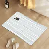 Alfombrilla de suelo de tierra de diatomeas a rayas estilo Ins para uso doméstico, alfombrilla de baño, alfombrilla antideslizante para pies, felpudo de entrada, disponible para venta al por mayor