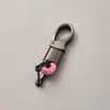 Directo de fábrica llavero de cuerda tejida accesorios de ferretería hebilla de herradura colgante para llave de coche accesorios de coche de moda