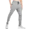 Calças de treino para corrida e fitness muscular masculinas de algodão Slim Fit para primavera e outono, irmãos, calças de treino para pés, comércio exterior, leve, sem logo