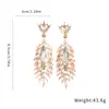Pendientes de Pluma de Lujo Transfronterizos Europeos y Americanos con Borla y Pedrería Pendientes de Botón para Mujer Combinación para Vestido de Fiesta Pendientes al por Mayor
