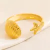 Anillo de Acero Inoxidable con Forma de Estrella de Mar Transfronterizo Simple Concha de Estrella Nicho Joyería de Lujo Ligero Color Dorado 18K Anillo Libre de Color