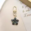 Nuevo Artículo Popular de Venta Cruzada Flor de Cinco Hojas Coreana Colgante de Pera Llavero Colgante de Bolsa Flor de Cerezo Pequeño Regalo