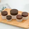 Frasco de crema color crema esmerilado con tapa de veta de madera negra, botella rellenable de vidrio esmerilado para cosméticos, botella vacía para mascarilla facial, crema facial, crema para ojos, ungüento
