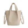 Bolso Cubo de Estilo Coreano de Nicho para Mujer Modelo Nuevo Primavera 2026 Bolso de Hombro Cruzado Elegante de Gama Alta
