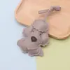 Nuevo Colgante de Perro de Peluche Muñeca de Cuero Decoración de Bolso Llavero Perro de Dibujos Animados de Cuero Sintético Colgante de Mochila