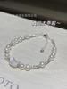 Pulsera de perlas naturales de agua dulce de plata S925 con cabeza de gato en el hielo. Lujo accesible. Pulseras de pareja de plata rota 2024.