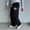Pantalones de chándal casuales de pierna ancha para pareja con gancho de bordado suave, tela cálida suave y amigable con la piel, diseño simple, pantalones que realzan la altura y estilizan