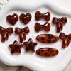 Combinação marrom linha leopardo estrela de cinco pontas amor arco resina remendo DIY brincos acessórios para cabelo material