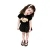 Conjunto de Verano Nuevo para Niñas 2026, Estilo Popular de Alta Venta de Este Año, Top Negro de Manga Corta con Dibujos y Shorts Delgados para Niñas