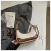 Bolsas de Mujer Transfronterizas 2026 Bolso de Mano de Nicho para el Trabajo Bolso de Hombro Underarm Retro Bolso Cruzado Pequeño Cuadrado Casual de Alta Gama