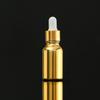 Botella de aceite esencial con galvanoplastia de oro, subbotella cosmética, botella de spray, botella de vidrio prensado, botella de loción crema a prueba de luz