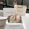 Una generación de nuevo bolso Boston de nicho chino con lazo, bolso tipo almohada retro otoño e invierno 2024 al por mayor
