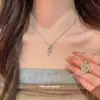 Collar con colgante de cruz y corazón de circonita estilo coreano para mujer, lujo ligero con un toque de alta gama, cadena para la clavícula, único, moderno y versátil, gargantilla