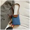Bolsas de palha de nicho super populares para mulheres no verão, nova bolsa transversal tecida da moda 2026, mini bolsa de celular requintada
