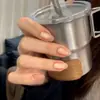 El Artículo de Moda Más Vendido de Celebridad de Internet de Xiaohongshu: Puntas de Uñas Ojo de Gato de Vidrio Dorado Champagne Ligeramente Borrachas con Tonos Rosados que Realzan el Cutis y Añaden un Toque de Lujo