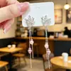 Nuevos pendientes de botón con borla de perla rosa de mariposa hueca estilo chino, pendientes colgantes, cadena larga, estilo deseo puro, pendientes versátiles adelgazantes para mujer