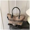 Bolso de Lona Rayado Transfronterizo para Mujer, Gran Capacidad, Nuevo Bolso Cruzado Versátil Otoño e Invierno 2026, Bolso de Mano Casual para Estudiantes Universitarios