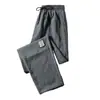 Pantalones Deportivos Rectos Talla Grande Estilo Coreano Venta al por Mayor Pantalones de Nueve Puntos Sueltos Seda de Hielo Nuevos Pantalones Casuales para Hombre Verano Etiqueta Estilo Delgado