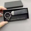 Llavero para coche de hombre de negocios textura avanzada patrón de fibra de carbono llavero para coche eléctrico logo logo logo creativo