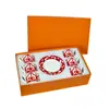 Juego de Porcelana Ósea Roja China Ventana de Hierro Española Taza de Café y Platillo Porcelana Ósea Roja China Seis Tazas y Seis Platillos Venta al por Mayor Transfronteriza