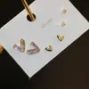 Pendientes pequeños de una semana, populares pendientes pequeños de aguja de plata S925, una tarjeta, tres pares de pendientes de combinación de traje, pendientes de circonita roja de red para mujer