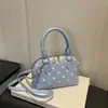 Bolsa de concha com poá estilo coreano transfronteiriça, bolsa de mão color blocking de nicho, bolsa transversal, luxo leve, de alta qualidade, moderna, elegante, bolsa de ombro