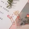 Venta al por mayor de fábrica creativo metal pequeño marcapáginas clip de papel exquisito flor de cerezo marcapáginas para niños papelería de aprendizaje