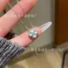 Colgante de trébol de cuatro hojas de jade azul de alta calidad, material natural peligroso, venta al por mayor de fábrica, pequeño colgante con incrustaciones de plata s925 fresca