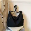 2026 Novo Estilo Simples e Artístico Bolsa Feminina de Lona de Ombro Único, Bolsa Tote Versátil Dobrada para o Trabalho, Bolsa Grande de Ombro