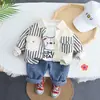Diseño Nuevo de Primavera y Otoño Camiseta con Estampado de Dibujos Animados Cuello Redondo Pantalones de Mezclilla Traje para Niños Conjunto de Dos Piezas Fabricante Venta al por Mayor