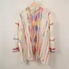 Capa de Estilo Étnico para Viajes y Vacaciones Abrigo de Punto con Borlas de Colores Cardigan Calado Ropa Exterior de Moda para Mujer Primavera y Verano
