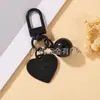 Estilo Casual y Lindo Llavero Colgante de Campana con Corazón Pintado Colorido Funda para Teléfono Móvil Bolso Auriculares Set de Accesorios Pequeños