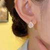 Aretes de moda simples de gota de agua con piedra ojo de gato, aretes de nicho de temperamento de alta gama, aretes franceses comodín suaves al por mayor