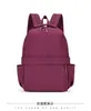 Mochila casual para hombres y mujeres, mochila impermeable de color liso, mochila escolar ligera de gran capacidad para estudiantes, mochila elegante para mujeres
