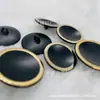 Botón de metal de alta gama al por mayor forma de cuenco botón cóncavo láser Phnom Penh traje abrigo suéter abrigo camisa botón