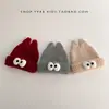 Gorro de inverno infantil, quente e espesso, com um design engraçado apresentando olhos grandes, estilo de puxar e proteção para as orelhas, adequado para meninos e meninas, e estiloso