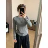 Camiseta de manga larga adelgazante de otoño con diseño de costuras visibles, top versátil adelgazante para mujer de primavera y otoño con hombros normales y alta elasticidad