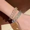Pulsera tejida calada de estilo vintage europeo y americano, sensación de lujo ligero y alta gama, versátil para el trabajo, accesorio de mano exquisito y simple al por mayor