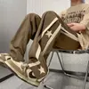 Marca de moda de calle pantalones casuales rectos de pierna ancha con caída a rayas para hombre primavera y otoño pantalones retro japoneses americanos