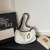 Bolso de hombro ligero estilo coreano para mujer, adecuado para la escuela y el trabajo, nueva colección de verano 2026, gran capacidad, bolso tipo bollo casual y moderno