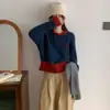Elegante top de punto versátil de bloques de color con lazo, nuevo para otoño, suéter de cuello redondo con botones de madera estilo coreano de moda para mujer
